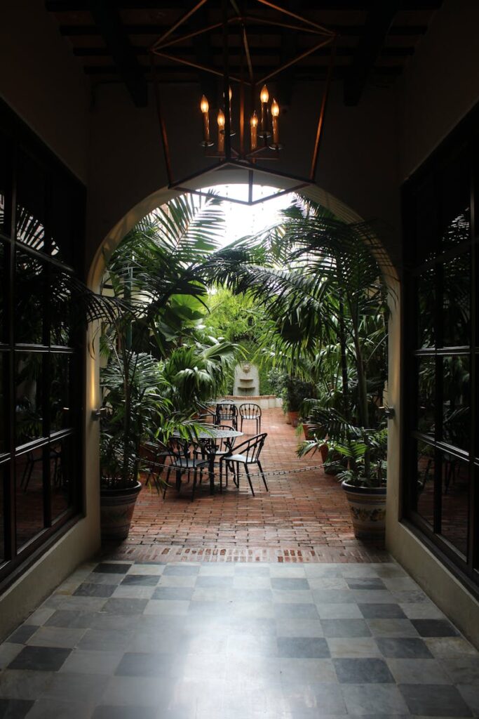 Serene outdoor patio surrounded by tropical plants in San Juan, Puerto Rico.